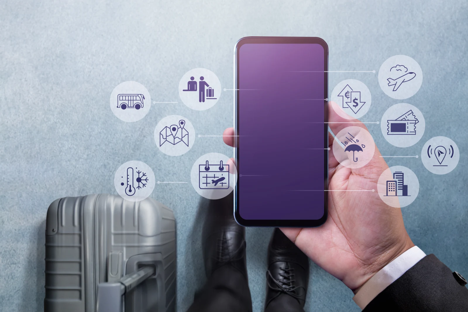 Businessman walking with suitcase using tablet travel management