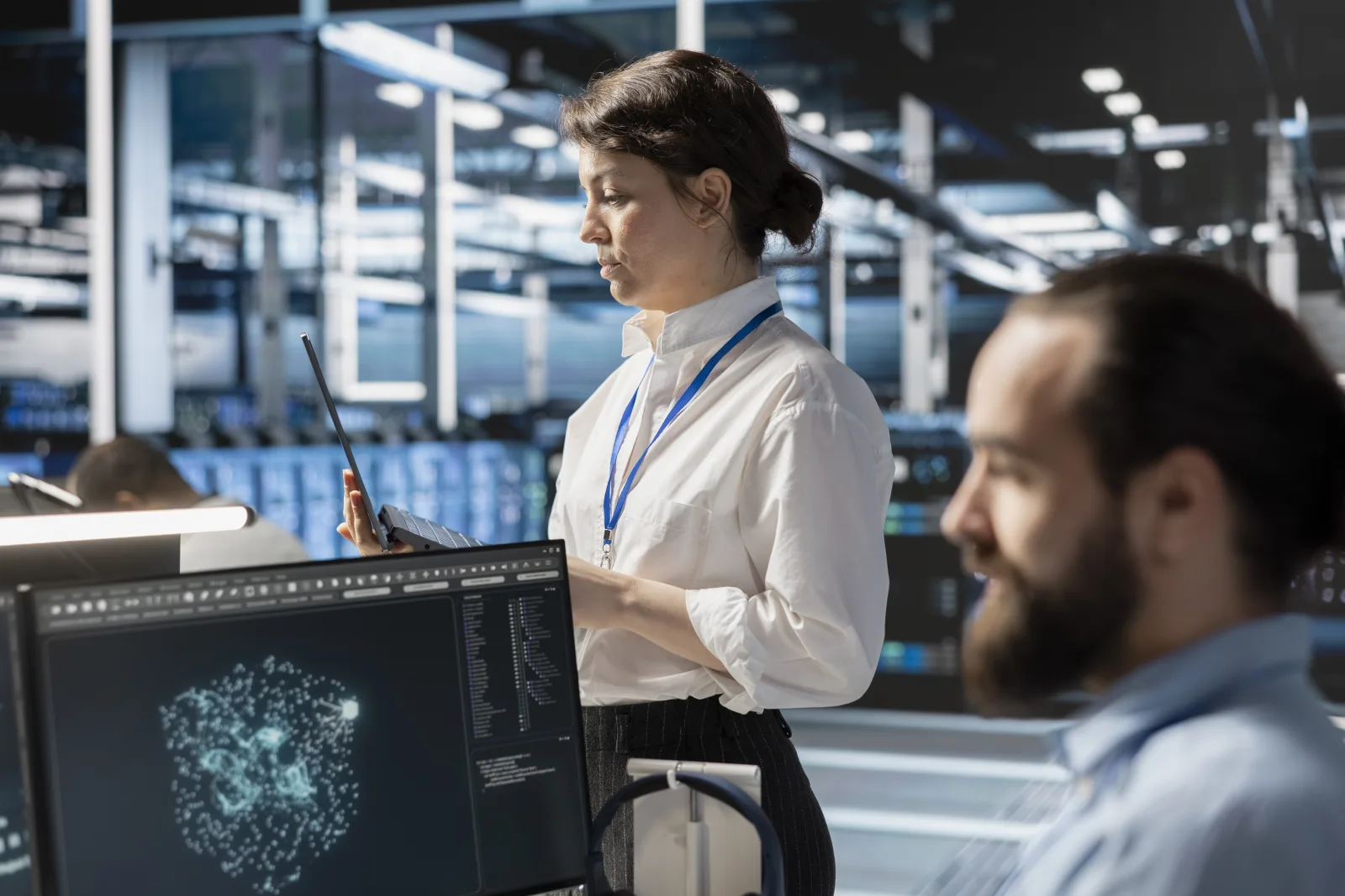 Admins using computer data center office running scripts
